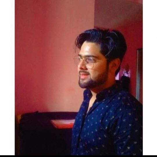 A man wear a shirt working .in Best Home Tuition Teachers In Lucknow ,